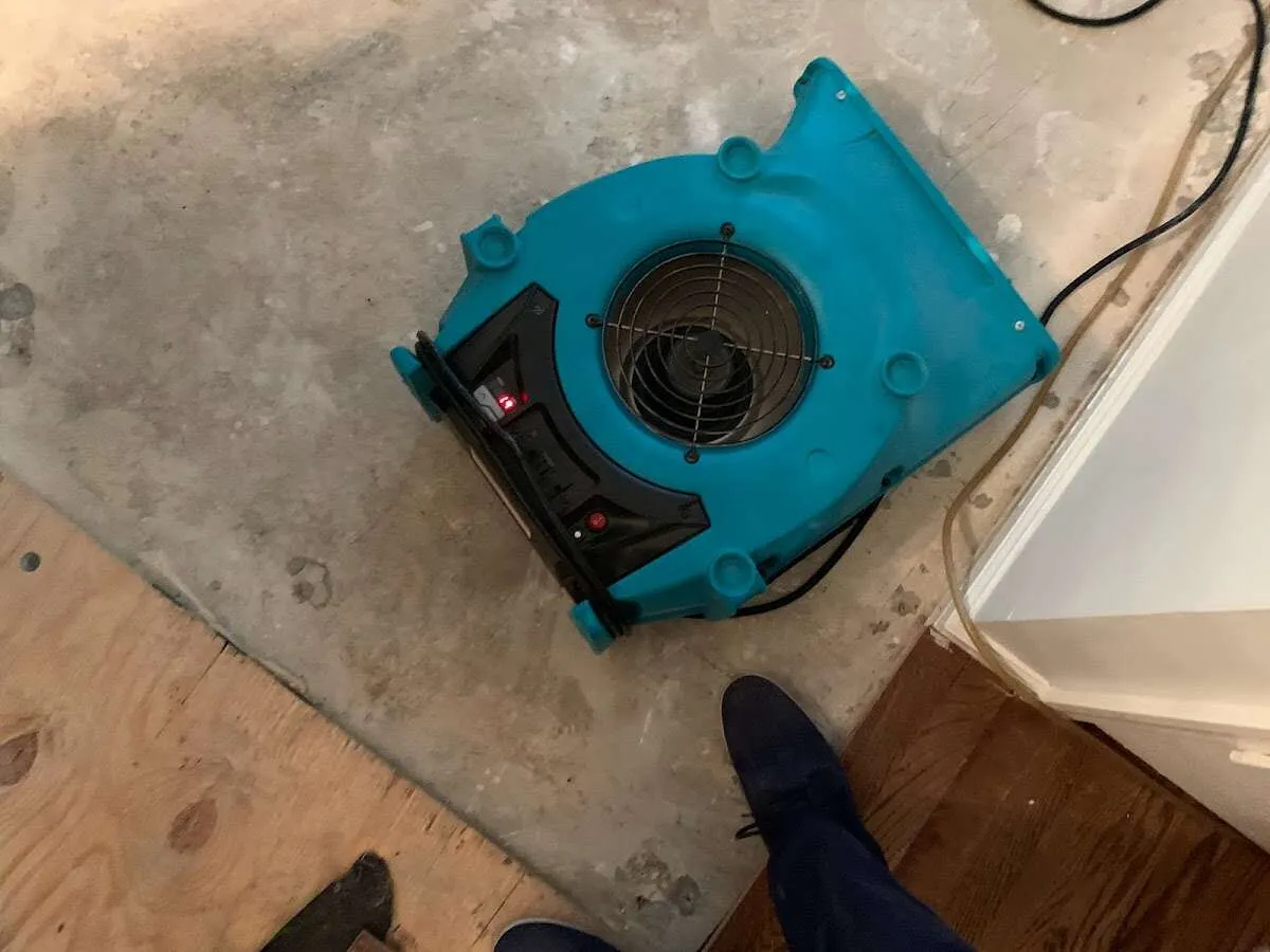 Air mover drying subfloor during Leak Detection & Repair in Key Biscayne